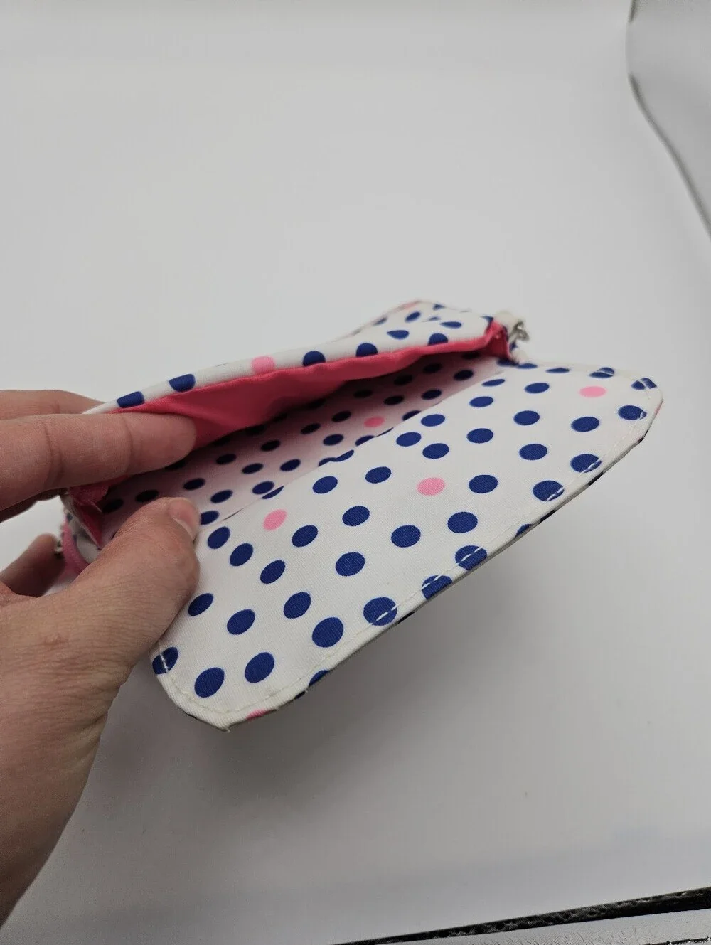 Scout white wristlet with blue polka dots and pin accents